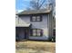 Two-story house with gray siding, a driveway, and a small yard at 4409 Lake Ridge Dr, Raleigh, NC 27604