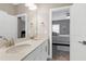 Double vanity bathroom with view of bedroom at 501 Old Ride Drive, Holly Springs, NC 27540