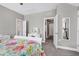 Bedroom with white dresser, and en-suite bathroom access at 501 Old Ride Drive, Holly Springs, NC 27540