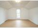 Bright bedroom featuring fresh white walls and a large window for natural light at 504 Washington St, Raleigh, NC 27605