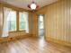 Bright dining room with hardwood floors, paneled walls and large windows providing natural light at 504 Washington St, Raleigh, NC 27605