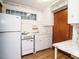 A kitchen view showing a refrigerator, stove, and kitchen sink at 504 Washington St, Raleigh, NC 27605