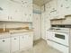 Retro kitchen with vintage appliances, classic cabinetry, and ample storage space at 504 Washington St, Raleigh, NC 27605