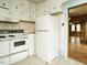A kitchen view showcasing the refrigerator, oven, and cupboards at 504 Washington St, Raleigh, NC 27605
