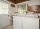 A laundry room with white washer and dryer at 504 Washington St, Raleigh, NC 27605