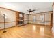 Spacious living room with hardwood floors, brick fireplace and ceiling fan at 5209 Rivington Rd, Fuquay Varina, NC 27526