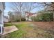 Large backyard with patio and mature trees at 5321 Baywood Forest Dr, Knightdale, NC 27545