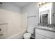Clean bathroom with granite countertop, bathtub and toilet at 5321 Baywood Forest Dr, Knightdale, NC 27545