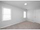 Spacious bedroom with neutral carpeting and ample natural light at 5321 Baywood Forest Dr, Knightdale, NC 27545