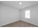 Well-lit bedroom with neutral carpeting and a window at 5321 Baywood Forest Dr, Knightdale, NC 27545
