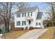 Two-story house with white siding, brick base, and a driveway at 5321 Baywood Forest Dr, Knightdale, NC 27545