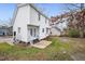 Two story house with white siding, grey steps and a backyard at 5321 Baywood Forest Dr, Knightdale, NC 27545