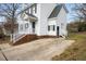 Two story house with white siding, brick base and driveway at 5321 Baywood Forest Dr, Knightdale, NC 27545