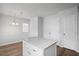 Kitchen features an island and white cabinets at 5321 Baywood Forest Dr, Knightdale, NC 27545