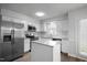 Modern kitchen featuring stainless steel appliances and granite countertops at 5321 Baywood Forest Dr, Knightdale, NC 27545