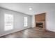 Living room with brick fireplace and hardwood floors at 5321 Baywood Forest Dr, Knightdale, NC 27545