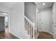 Bright entryway with staircase, hardwood floors, and neutral walls at 5321 Baywood Forest Dr, Knightdale, NC 27545