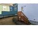 Wooden stairs leading up to the home's back entrance at 547 Vine Pkwy, Pittsboro, NC 27312