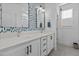 Stylish bathroom with double vanity and patterned wall at 547 Vine Pkwy, Pittsboro, NC 27312