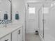 Modern bathroom with a glass shower and white tile at 547 Vine Pkwy, Pittsboro, NC 27312