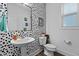 Stylish bathroom with black and white patterned wall at 547 Vine Pkwy, Pittsboro, NC 27312