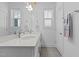 Bright bathroom with double vanity and updated fixtures at 547 Vine Pkwy, Pittsboro, NC 27312