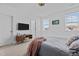 Comfortable bedroom with a TV and ample closet space at 547 Vine Pkwy, Pittsboro, NC 27312