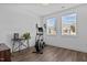 Bright bedroom with elliptical machine and wood-look flooring at 547 Vine Pkwy, Pittsboro, NC 27312