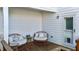 Relaxing deck with wicker chairs and side tables at 547 Vine Pkwy, Pittsboro, NC 27312
