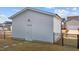 Single car detached garage with a door and light fixture at 547 Vine Pkwy, Pittsboro, NC 27312