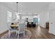 Round dining table with four chairs in open kitchen at 547 Vine Pkwy, Pittsboro, NC 27312