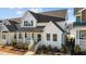 Charming two-story farmhouse with gray roof and white siding at 547 Vine Pkwy, Pittsboro, NC 27312