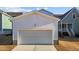 Detached single car garage with a wide driveway at 547 Vine Pkwy, Pittsboro, NC 27312