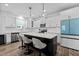 Contemporary kitchen with white cabinets and island at 547 Vine Pkwy, Pittsboro, NC 27312