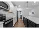 Modern kitchen with white cabinets and island at 547 Vine Pkwy, Pittsboro, NC 27312