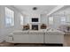 Spacious living room with sectional sofa and fireplace at 547 Vine Pkwy, Pittsboro, NC 27312