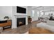 Gas fireplace and open floor plan with kitchen view at 547 Vine Pkwy, Pittsboro, NC 27312