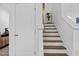 Modern staircase with white risers and dark wood treads at 547 Vine Pkwy, Pittsboro, NC 27312