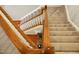 Upstairs hall with carpeted staircase and railing at 626 Churton Grove Blvd, Hillsborough, NC 27278