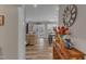 View through entryway to living room and kitchen with hardwood floors at 63 Eastland Ct, Smithfield, NC 27577