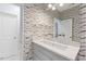 Modern bathroom with a unique patterned wallpaper and marble vanity at 805 Pinehurst Dr, Chapel Hill, NC 27517