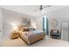 Bedroom with light walls, a rattan bed, and a blue chair at 805 Pinehurst Dr, Chapel Hill, NC 27517