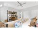 Bedroom with built-in shelves, desk, and bed with colorful bedding at 805 Pinehurst Dr, Chapel Hill, NC 27517