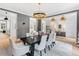 Formal dining room with a dark wood table and white chairs at 805 Pinehurst Dr, Chapel Hill, NC 27517