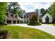 House exterior with a three-car garage and a circular driveway at 805 Pinehurst Dr, Chapel Hill, NC 27517