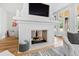 Elegant fireplace with a white mantel, adding a focal point to the living room at 805 Pinehurst Dr, Chapel Hill, NC 27517