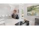 Game room features a wet bar, seating area, and access to balcony at 805 Pinehurst Dr, Chapel Hill, NC 27517