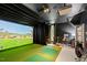 Impressive home golf simulator with viewing area and bar at 805 Pinehurst Dr, Chapel Hill, NC 27517