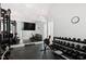 Well-equipped home gym with various exercise machines at 805 Pinehurst Dr, Chapel Hill, NC 27517