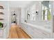 Butler's pantry with white cabinets and quartz countertops at 805 Pinehurst Dr, Chapel Hill, NC 27517